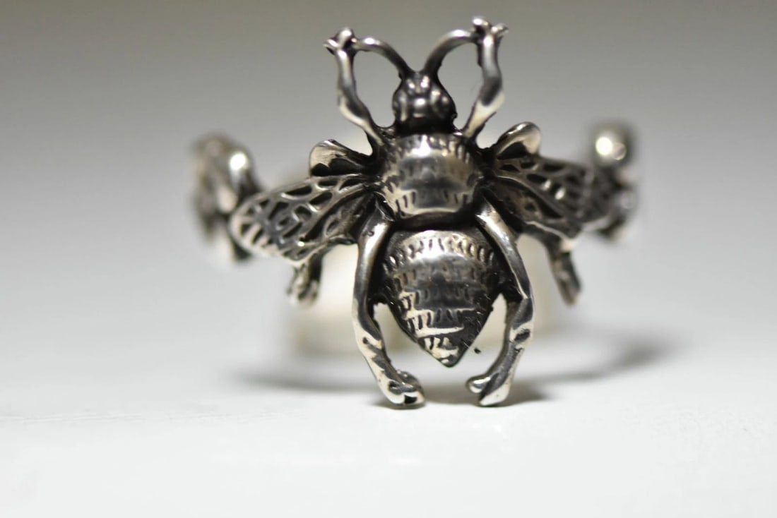 BEE RING YELLOW JACKET BUG BAND STERLING SILVER WOMEN GIRLS: BEE RING YELLOW JACKET BUG BAND STERLING SILVER WOMEN GIRLS Bee ring yellow jacket bug band sterling silver women girls Size 9.75 Weight 9.3g Widest part of the ring 1" Thinnest part of the ring 1/8"