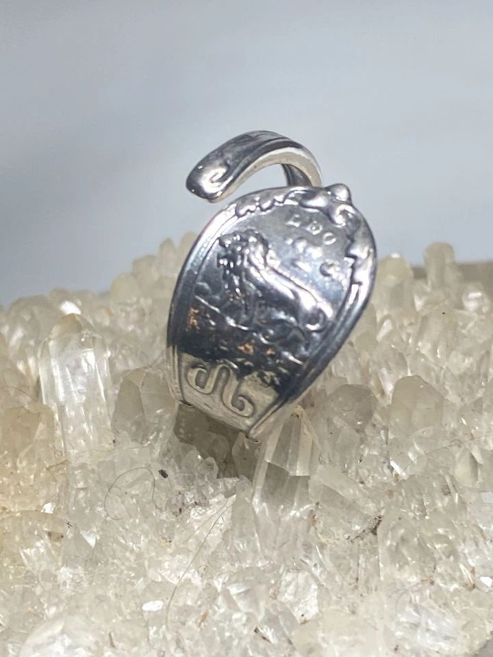 LEO SPOON RING SIZE 7.50 AUGUST LION BIRTHDAY BAND STERLING SILVER WOMEN ADJ: LEO SPOON RING SIZE 7.50 AUGUST LION BIRTHDAY BAND STERLING SILVER WOMEN ADJ Leo spoon ring August Lion birthday band sterling silver women Size 7.50 adjustable Weight. 4.3g Width 1/2" Thinnest part o