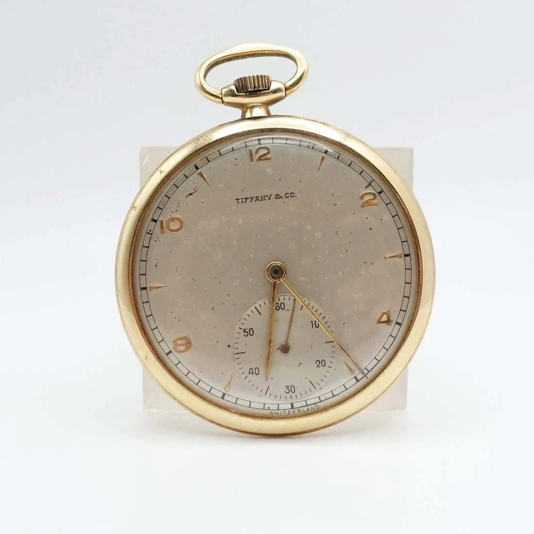 TIFFANY & CO. 14K YELLOW GOLD OPEN FACE MANUAL POCKET WATCH - 45482: Vintage Tiffany & Co. 14K Yellow Gold Movado Movement Open Face Pocket Ref - 45482 Serial Number - 550137 Manual Watch 43mm Wide Height - 2.1" Width - 1.8"