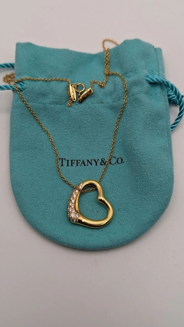 TIFFANY & CO 18K GOLD ELSA PERETTI .38CT DIAMOND OPEN HEART PENDANT NECKLACE 16": Tiffany & Co. 18K Yellow Gold Elsa Peretti Open Heart Diamond Pendant Necklace Length - 16" Pendant Size - 21mm Total Weight - 8.0 Gram Excellent Condition & Very Well Kept Pouch NOT Included