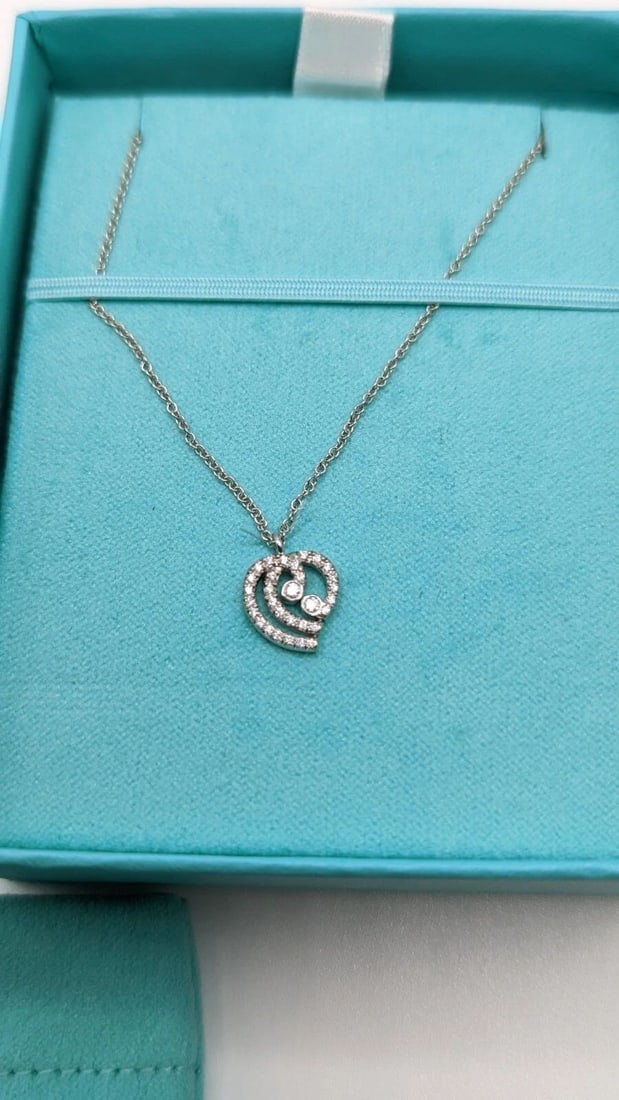 TIFFANY & CO. PLATINUM DIAMOND HEART PENDANT NECKLACE - 16" LONG: Tiffany & Co. Platinum Diamond Heart Pendant Necklace Length - 16" Long Pendant Size - 10mm Total Weight - 3.1 Grams Excellent Condition & Very Well Kept Box & Pouch Included