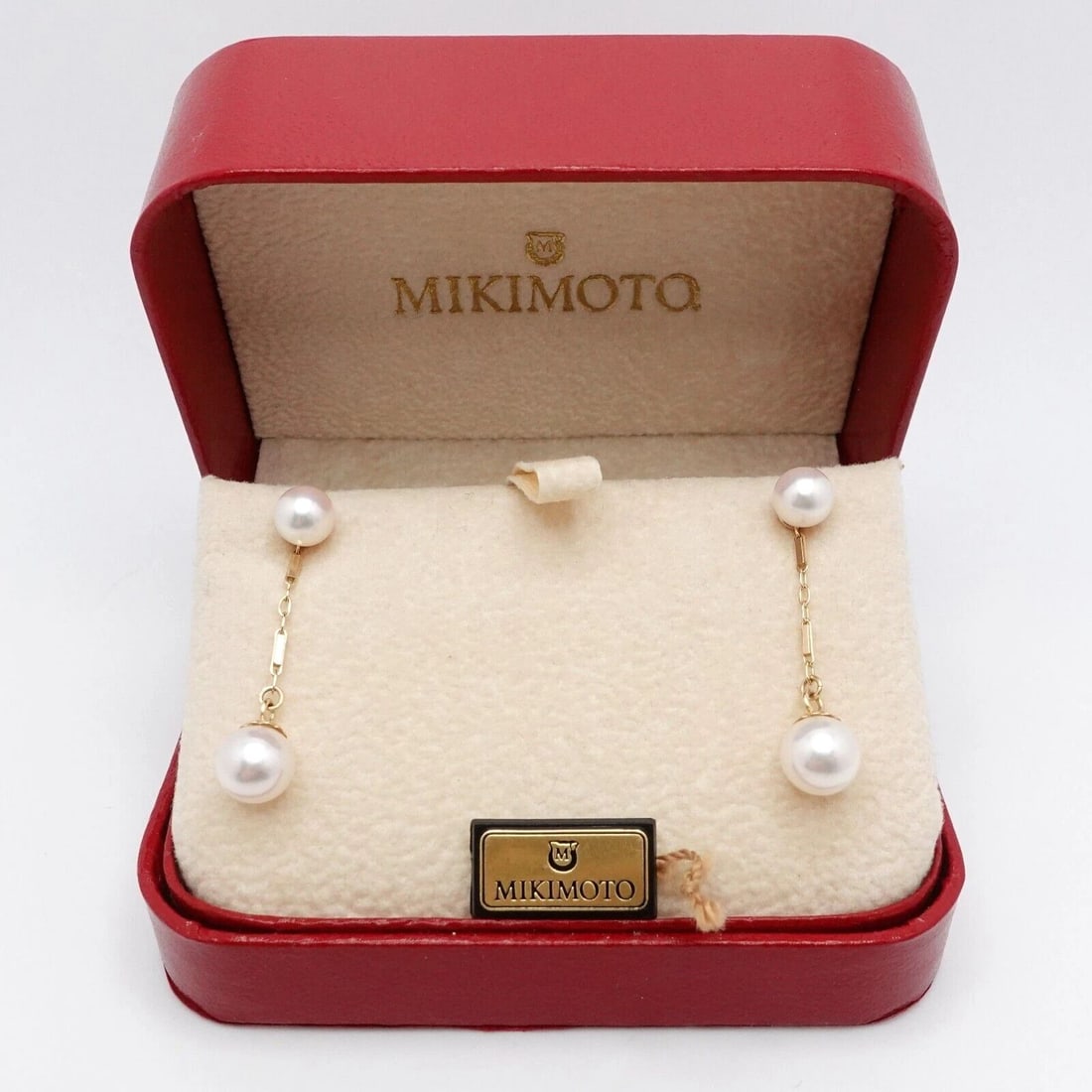 MIKIMOTO 14K YELLOW GOLD PEARL STUD DANGLE EARRINGS: MIKIMOTO 14K YELLOW GOLD PEARL STUD DANGLE EARRINGS Mikimoto 14K Yellow Gold Pearl Stud Dangle Earrings Pearl Sizes - 6mm & 7mm Pearl Color - White with Pink Overtone Height with Dangle Pearl - 1.25" 