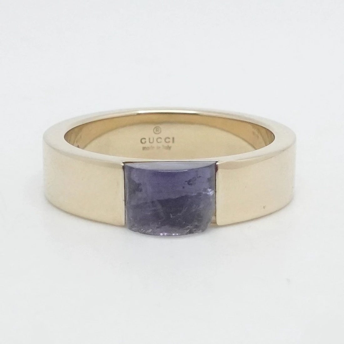 GUCCI 18K YELLOW GOLD PURPLE GEMSTONE WIDE BAND RING SIZE 6.75: GUCCI 18K YELLOW GOLD PURPLE GEMSTONE WIDE BAND RING SIZE 6.75 GUCCI 18K Yellow Gold Purple Gemstone Wide Band Ring Size 6.75 Band Width - 5mm Band Depth - 2mm Thick Total Weight - 7.9 Grams No Box & 