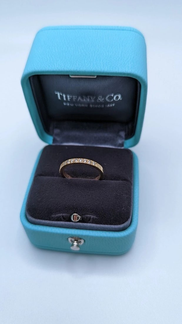 TIFFANY & CO. SOLESTE 18K GOLD HALF ETERNITY 0.17 CT DIAMOND RING SIZE 4 BOX: Tiffany & Co. Soleste 18k Gold Half Eternity 0.17 Ct Diamond Ring Ring Size - 4 Width - 2mm Total Weight - 2.1 Grams Excellent Condition & Very Well Kept
