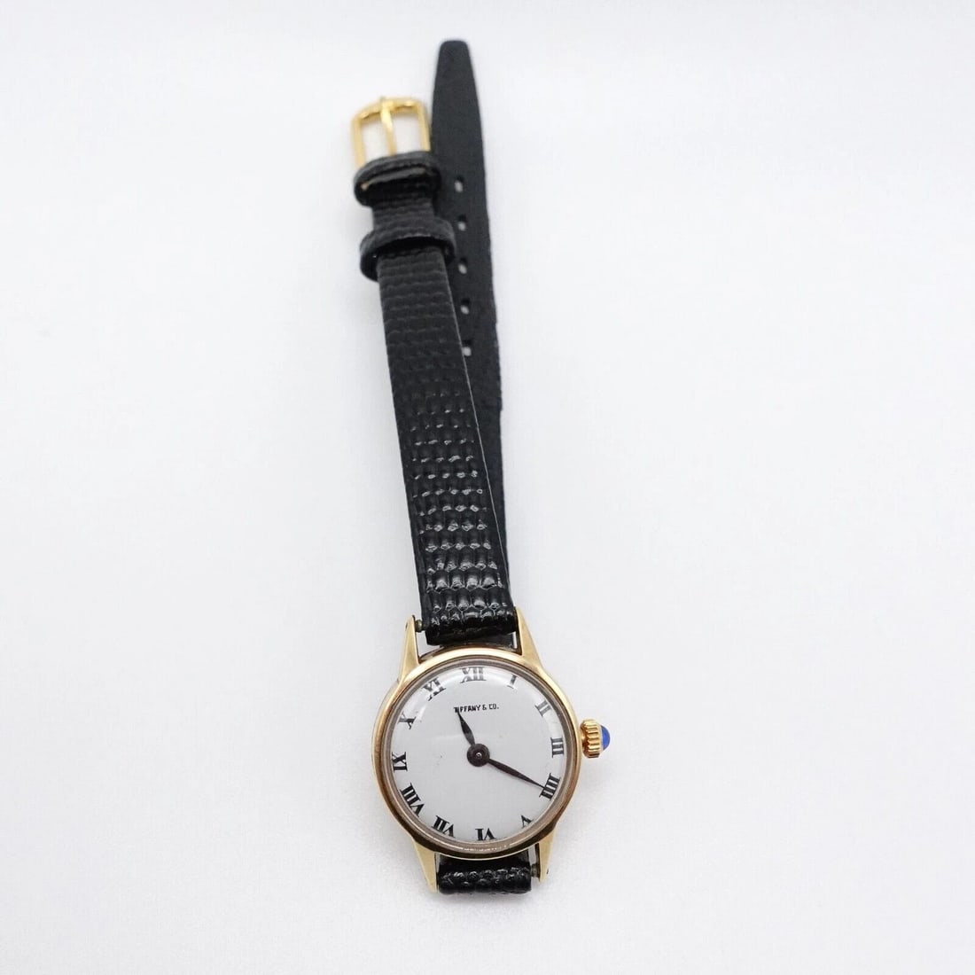 TIFFANY & CO. 14K YELLOW GOLD MANUAL WIND WATCH 18.5MM: Tiffany & Co. 14K Yellow Gold Manual Wind Watch with aftermarket genuine leather strap Case Size - 18.5mm Total Length - 7.75" Long Back Case # 2032261 306453 Box or Papers NOT Included