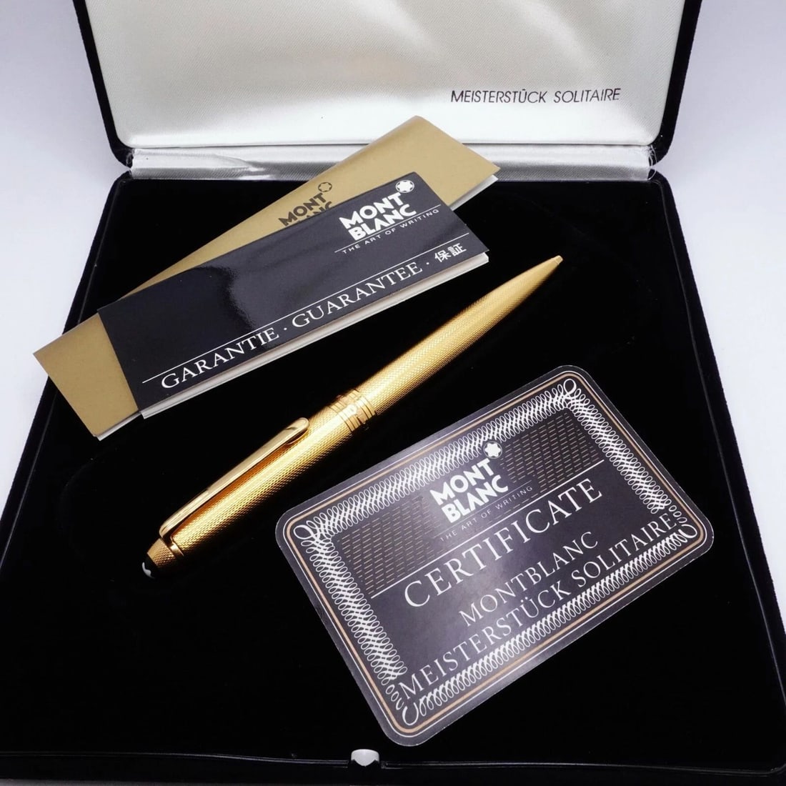 MONTBLANC MEISTERSTUCK SOLITAIRE GOLD BALLPOINT PEN - PAPER & BOX: MONTBLANC MEISTERSTUCK SOLITAIRE GOLD BALLPOINT PEN - PAPER & BOX Montblanc Meisterstuck Solitaire Vintage Gold Ballpoint Pen Serial # 04129 Certification Paper & Original Box Included
