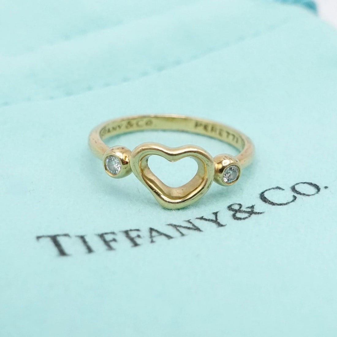 TIFFANY & CO. ELSA PERETTI 18K YELLOW GOLD OPEN HEART DIAMOND RING SIZE 5.25: Tiffany & Co. Elsa Peretti 18K Yellow Gold Open Heart Diamond Ring Size - 5.25 Band Width - 2mm Total Weight - 2.3 Grams Pouch NOT Included
