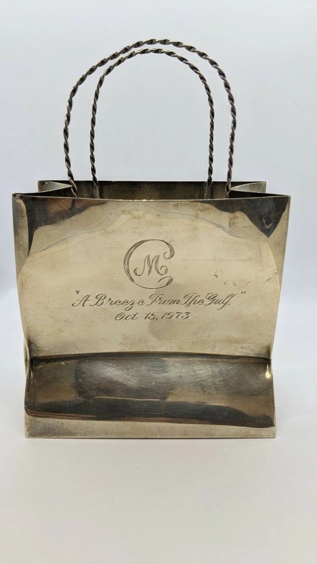 CARTIER STERLING SILVER HAND MADE SHOPPING BAG - 6.19 OZT ETCHED: Cartier Sterling Silver Hand Made Shopping Bag Total Weight - 6.19 Ozt Engraved On Both Sides " A Breeze From The Gulf " Oct 15, 1973 " Love from the Esplanades " Great Condition & Very Well Kept