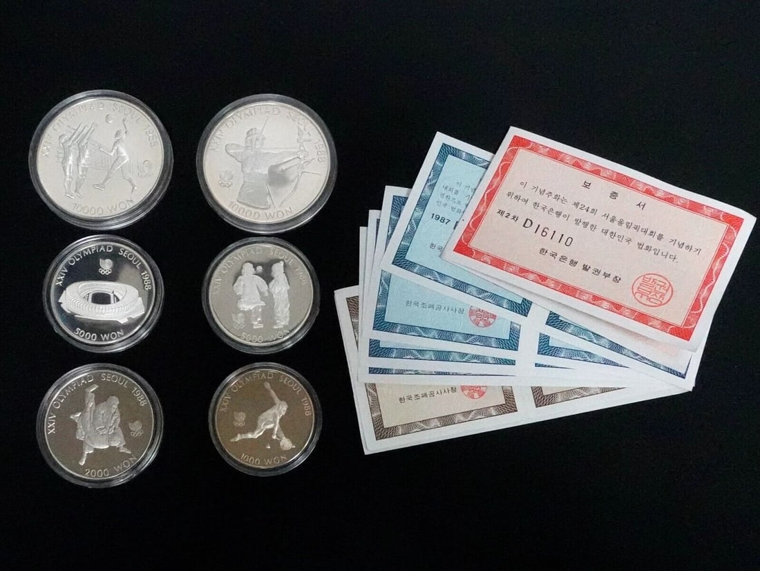 1987 SEOUL SOUTH KOREA XXIVTH OLYMPIAD COMMEMORATIVE 6 PROOF WON COIN COA: 1987 SEOUL SOUTH KOREA XXIVTH OLYMPIAD COMMEMORATIVE 6 PROOF WON COIN COA 1987 Seoul South Korea XXIVth Olympiad Commemorative 6 Proof Won Coin The following coins include; (2) 10,000 Won .925 Silver 