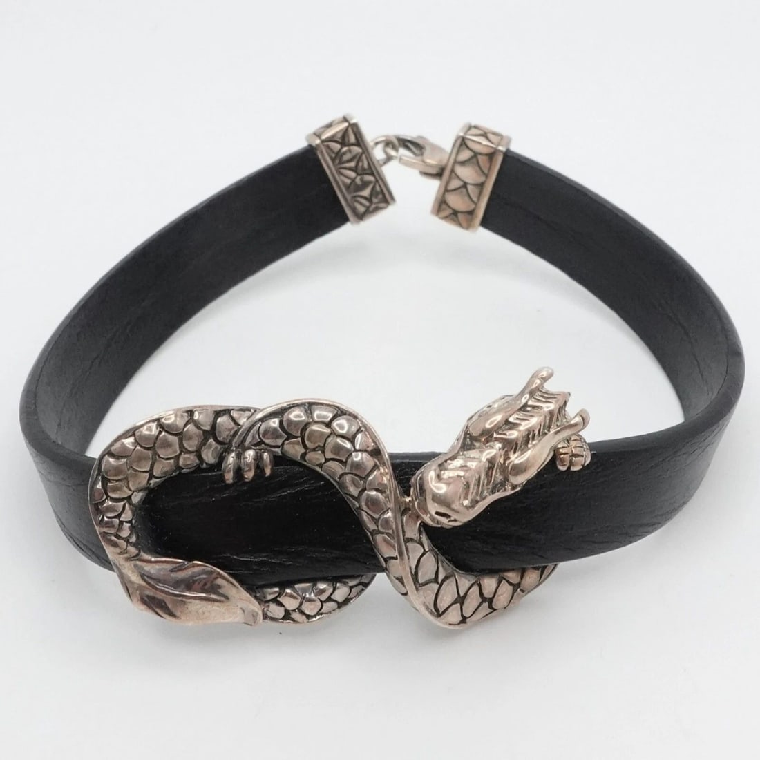 JOHN HARDY STERLING SILVER NAGA DRAGON LEATHER BRACELET 7" LONG: John Hardy Sterling Silver Naga Dragon Leather Bracelet Length - 7" Long Fits up to Relax 6.5"- 6.75" Snug Wrist Leather Width - 9.5mm Dragon Motif Size - 3/4" x 1.50" Total Weight - 17.3 Grams Hallma