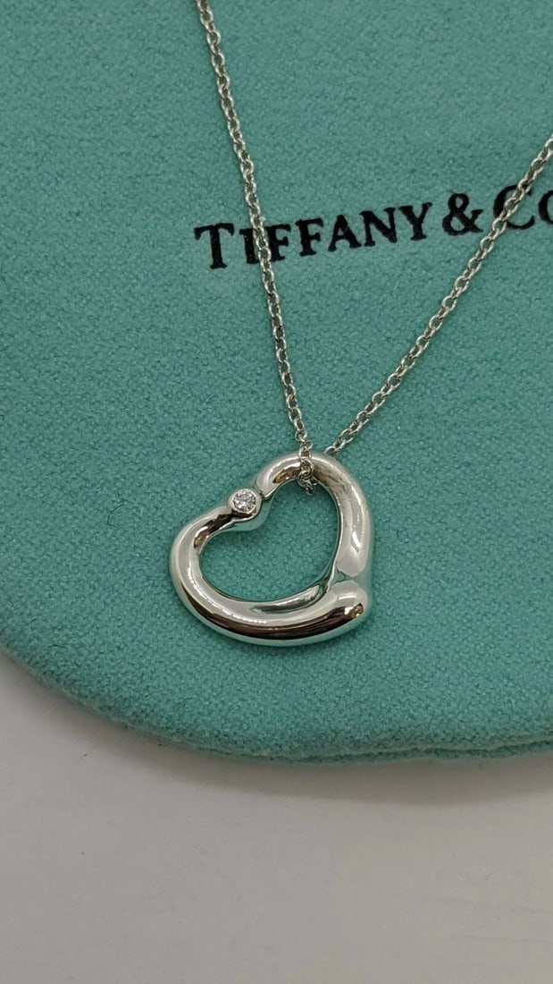 TIFFANY & CO. ELSA PERETTI SILVER OPEN HEART SMALL PENDANT DIAMOND NECKLACE 16": Tiffany & Co. Elsa Peretti Sterling Silver Open Heart Diamond Small Pendant Necklace Pendant Size -16mm Wide Chain Length - 16" Long Total Weight - 3.4 Grams Professionally Polished & Looks Brand New 