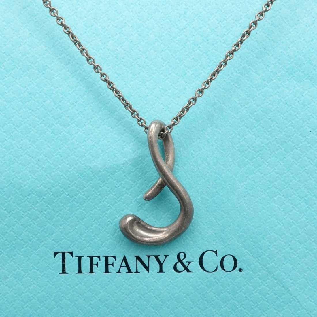 TIFFANY & CO. PERETTI STERLING SILVER INITIAL LETTER S PENDANT LONG NECKLACE 30": TIFFANY & CO. PERETTI STERLING SILVER INITIAL LETTER S PENDANT LONG NECKLACE 30" Tiffany & Co. Elsa Peretti Sterling Silver Cursive Initial Letter S Pendant Long Necklace Length - 30" Long Chain Width