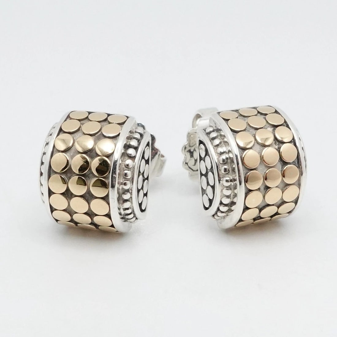 JOHN HARDY DOT 18K YELLOW GOLD STERLING SILVER STUD EARRINGS: JOHN HARDY DOT 18K YELLOW GOLD STERLING SILVER STUD EARRINGS John Hardy Dot 18K Yellow Gold Sterling Silver Stud Earrings Height - 13mm Width - 11mm Depth - 7mm Thick Est. Retail Price - $595 USD + Ta