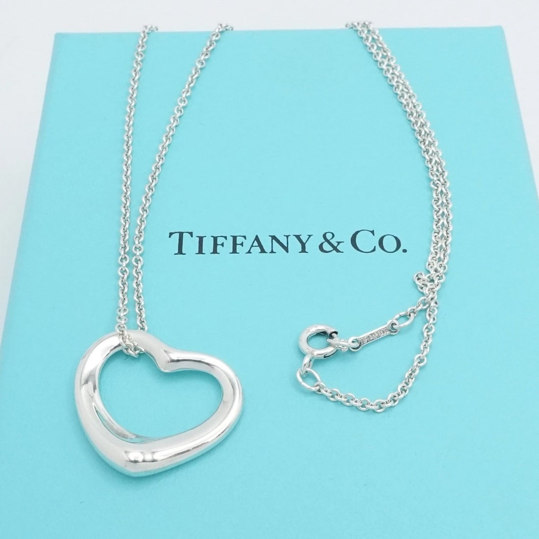 TIFFANY & CO. PERETTI STERLING SILVER OPEN HEART 22MM PENDANT NECKLACE 16" BOX: TIFFANY & CO. PERETTI STERLING SILVER OPEN HEART 22MM PENDANT NECKLACE 16" BOX Tiffany & Co. Elsa Peretti Sterling Silver Open Heart Pendant Chain Necklace Length - 16" Long Chain Width - 1.5mm Thick 