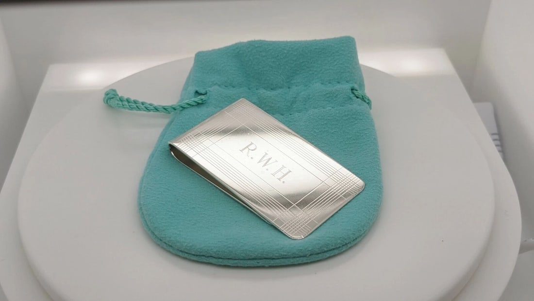 TIFFANY & CO. STERLING SILVER MONEY CLIP - 2.25" X 1.25" ETCHED: Tiffany & Co. Sterling Silver Money Clip Dimensions - 2.25" Long x 1.25" Wide Total Weight - 30.4 Grams Professionally Polished & Looks Like New Engraved On Front Pouch Included