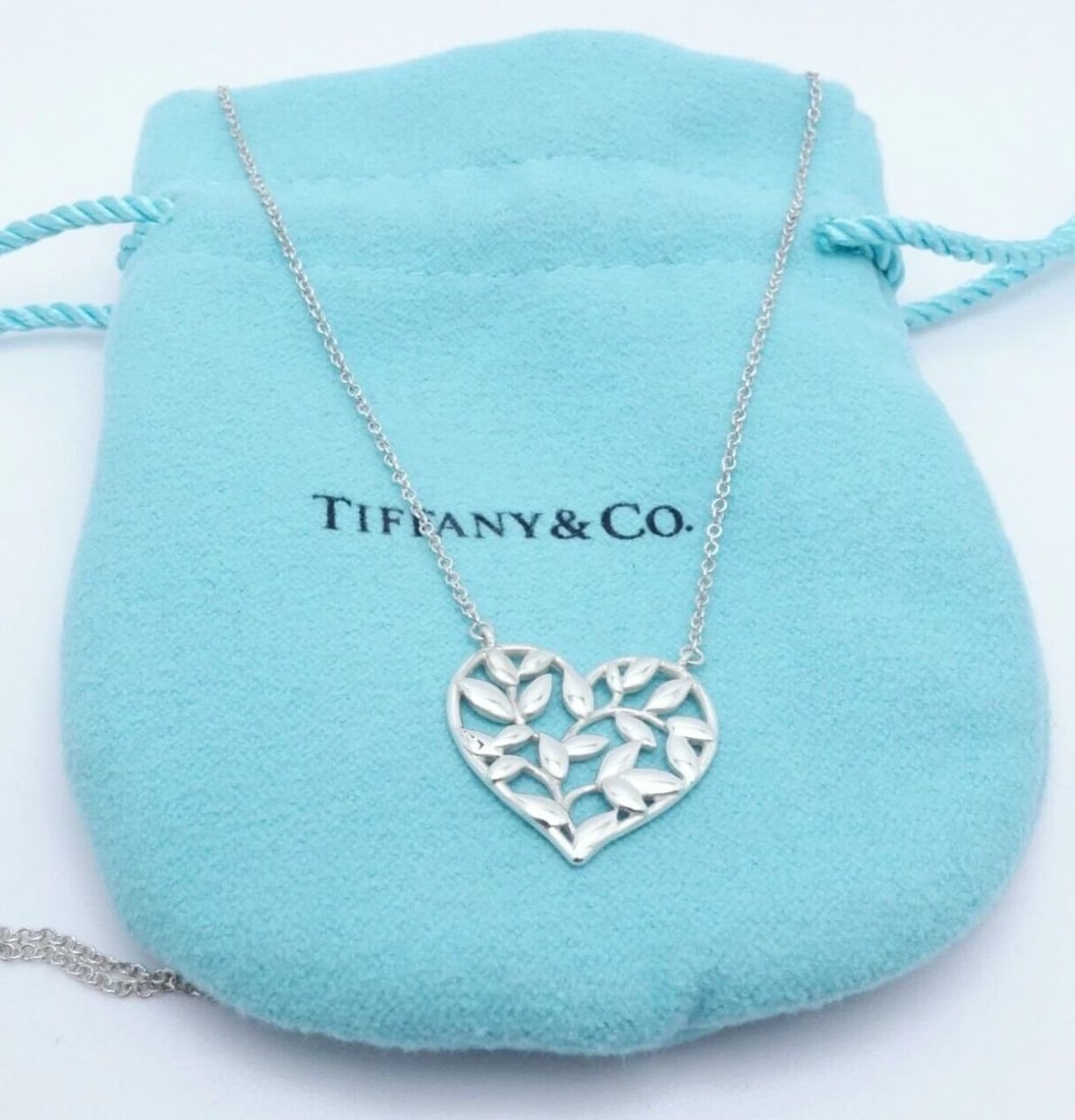 TIFFANY & CO. PALOMA PICASSO STERLING SILVER OLIVE LEAF HEART NECKLACE - 17.75": Tiffany & Co. Sterling Silver Paloma Picasso Olive Leaf Heart Pendant Necklace Length - 17.75" Long Pendant Size - 18mm Wide Total Weight - 2.4 Grams Retail - $250 USD Professionally Polished & Looks 
