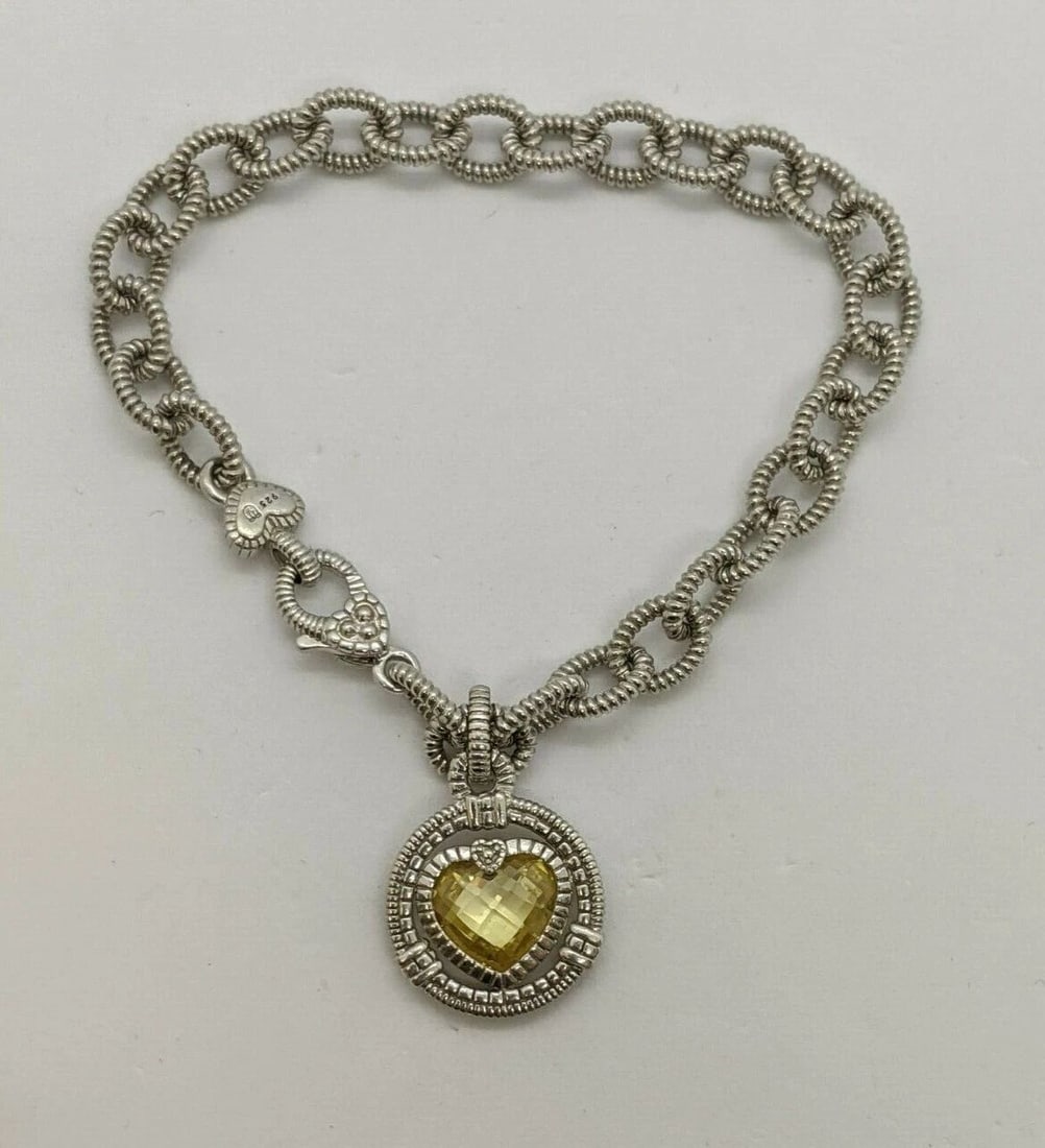 JUDITH RIPKA STERLING SILVER CANARY HEART DANGLE CHARM CHAIN BRACELET 7.25" LONG: JUDITH RIPKA STERLING SILVER CANARY HEART CHARM CHAIN BRACELET - 7.25" LONG Judith Ripka Sterling Silver Heart Charm Bracelet Length - 7.25" Long Total Weight - 22.3 Grams Excellent Condition & Looks 