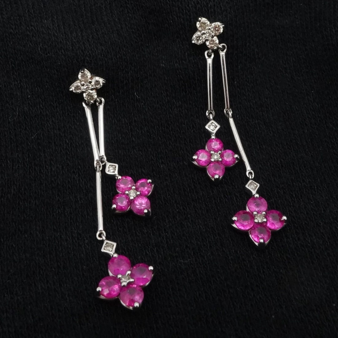 STERLING SILVER PINK RUBY DIAMOND FLOWER DAINTY DANGLE EARRINGS: STERLING SILVER PINK RUBY DIAMOND FLOWER DAINTY DANGLE EARRINGS Sterling Silver Pink Ruby Diamond Flower Dainty Dangle Earrings Flower Width - 6.5mm Total Weight - 2.3 Grams Hallmark - 925 (on prong) 