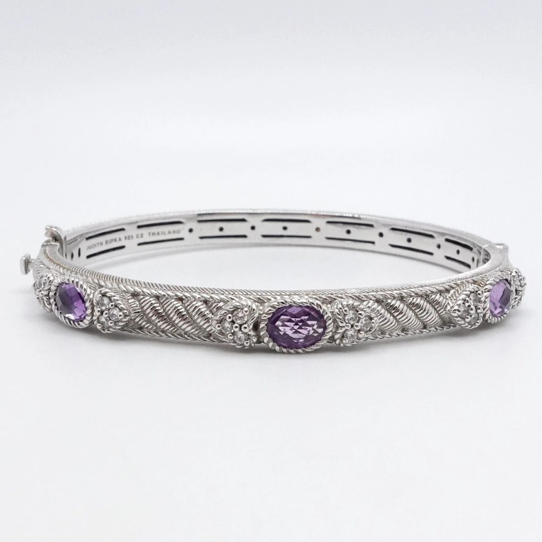 JUDITH RIPKA STERLING SILVER AMETHYST CZ CUBIC ZIRCONIA BANGLE BRACELET 7.25": JUDITH RIPKA STERLING SILVER AMETHYST CLEAR CUBIC ZIRCONIA BANGLE BRACELET 7.25" Judith Ripka Sterling Silver Amethyst & Clear Cubic Zirconia Hinged Bangle Bracelet Fits up to 7.25" Wrist Cuff Width -