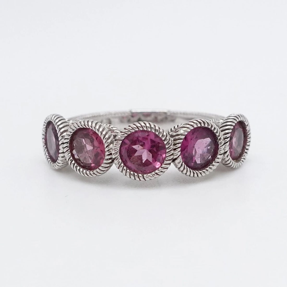 JUDITH RIPKA STERLING SILVER RHODOLITE BAND RING - SIZE 7.25: JUDITH RIPKA STERLING SILVER RHODOLITE BAND RING - SIZE 7.25 Judith Ripka Sterling Silver Rhodolite Band Ring Size - 7.25 Band Width - 3mm Total Weight - 4.2 Grams