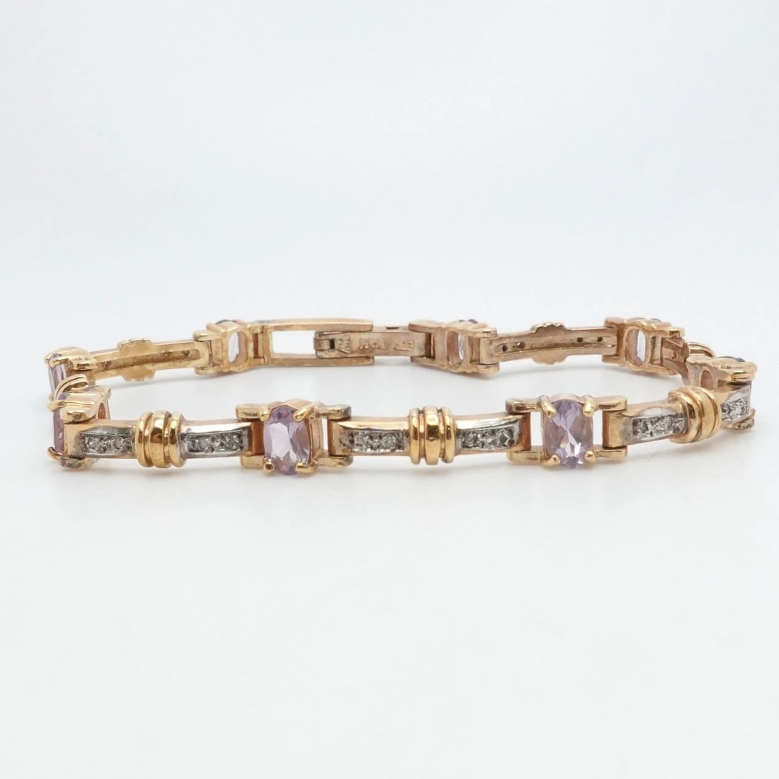 STERLING SILVER YELLOW GOLD PLATED OVAL IOLITE & DIAMOND TENNIS BRACELET 8" LONG: STERLING SILVER YELLOW GOLD PLATED OVAL IOLITE & DIAMOND TENNIS BRACELET 8" LONG Sterling Silver Yellow Gold Plated Oval Iolite & Diamond Tennis Bracelet Length - 8" Long Wrist Size - 7.25" and 7.5" C