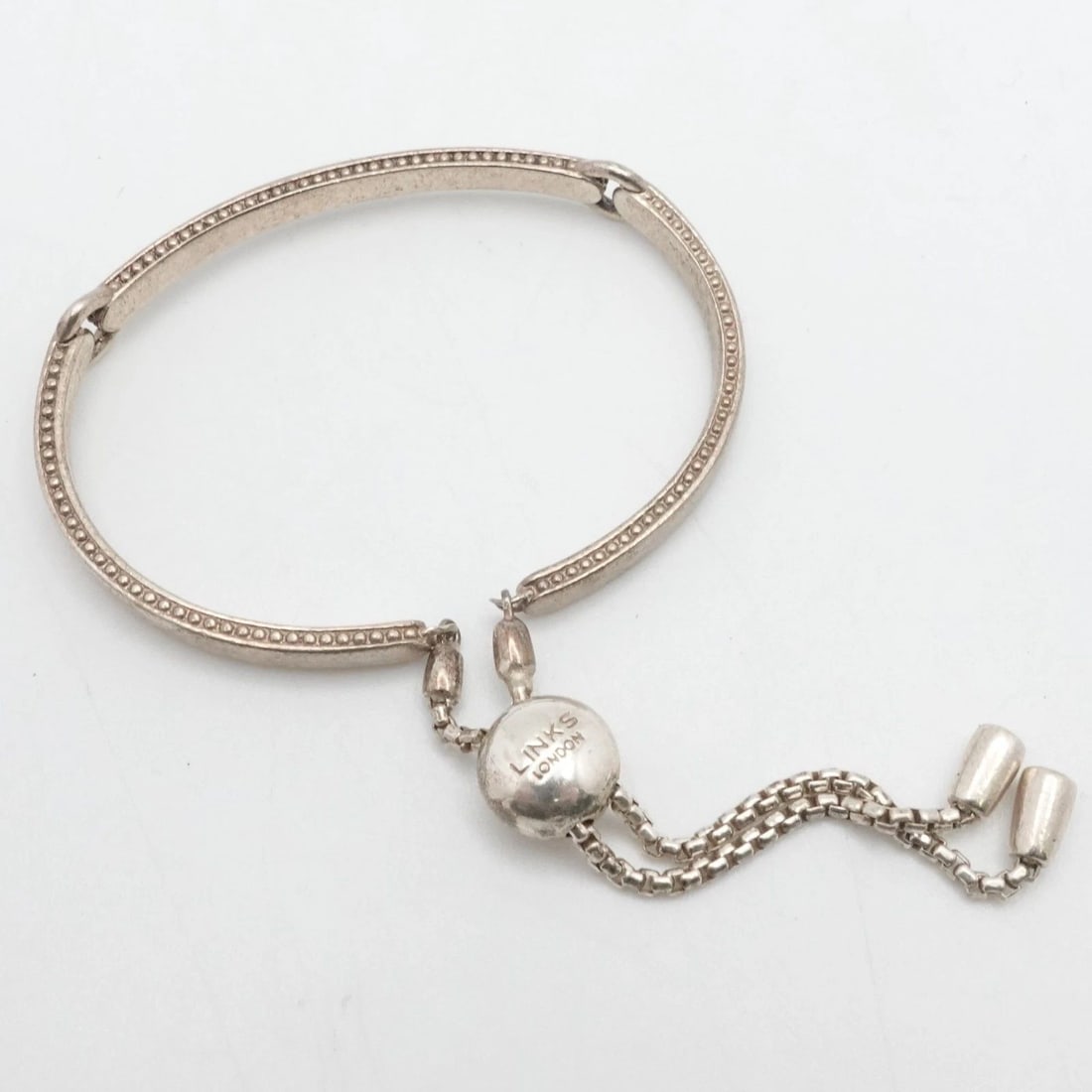 LINKS OF LONDON STERLING SILVER NARRATIVE TOGGLE ADJUSTABLE BRACELET: LINKS OF LONDON STERLING SILVER NARRATIVE TOGGLE ADJUSTABLE BRACELET Links of London Sterling Silver Narrative Toggle Adjustable Bracelet Fits up to Min 6.25" & up Chain Width - 4.5mm & 7mm Depth - 2.