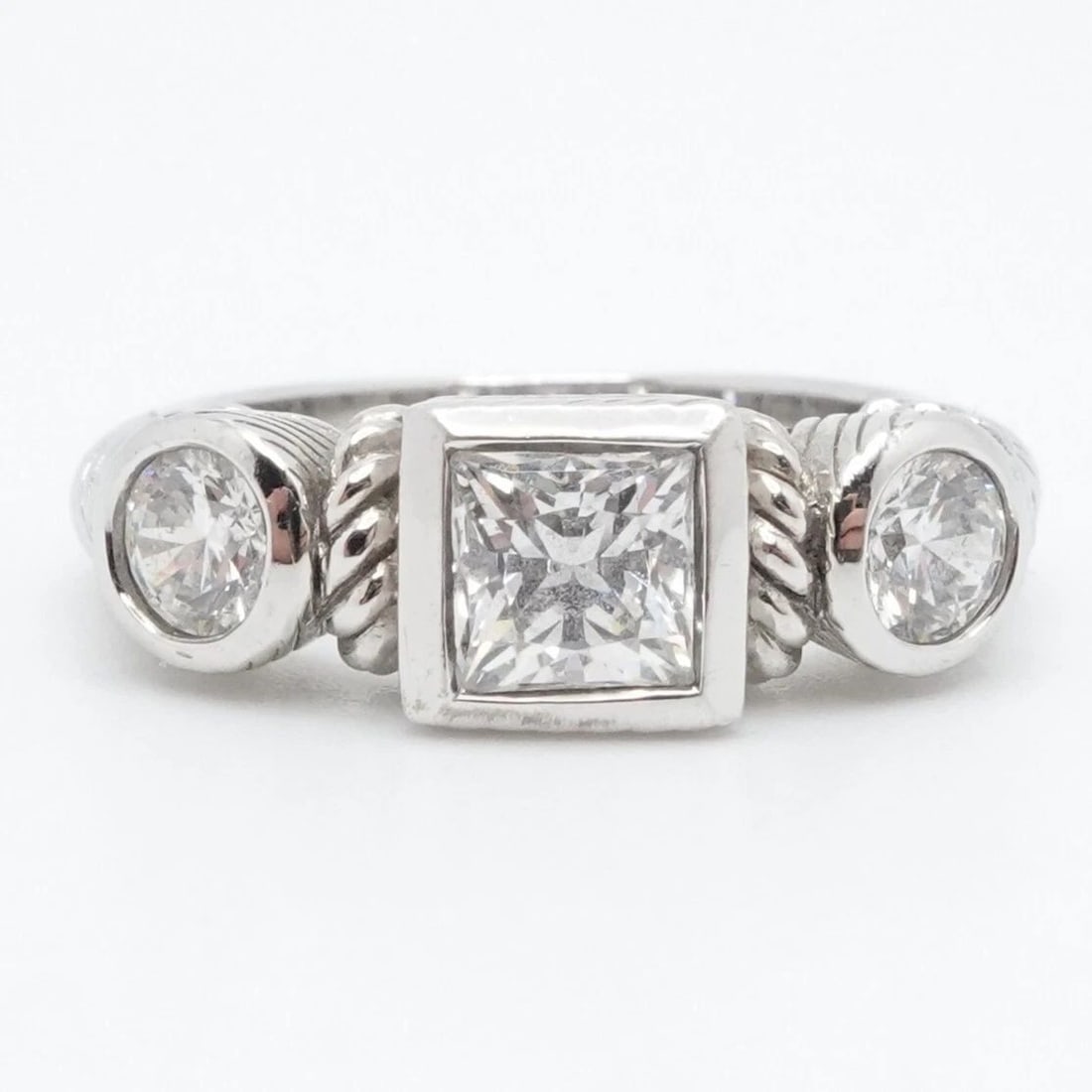 JUDITH RIPKA STERLING SILVER 3 CLEAR CUBIC ZIRCONIA CABLE RING SIZE 6.25: JUDITH RIPKA STERLING SILVER 3 CLEAR CUBIC ZIRCONIA CABLE RING SIZE 6.25 Judith Ripka Sterling Silver Square & Circle Bezel 3 Clear Cubic Zirconia Cable Ring Size - 6.25 Band Width - 3mm Height - 6mm 