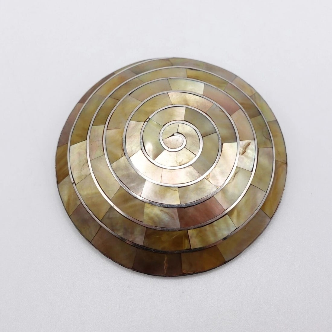 SILVER 950 PERU PACHAMAMA MOTHER OF PEARL INLAY SPIRAL PENDANT - 2": SILVER 950 PERU PACHAMAMA MOTHER OF PEARL INLAY SPIRAL PENDANT - 2" Silver 950 Peru Pachamama Mother of Pearl Gemstone Inlay Spiral Pendant Height - 2" Bail Height - 9mm Total Weight - 28.5 Grams