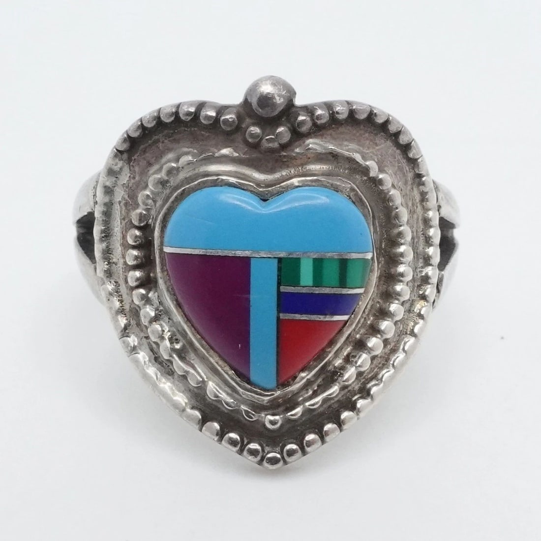 TAXCO STERLING SILVER MEXICO MULTI GEMSTONE HEART INLAY BAND RING SIZE 8.5: TAXCO STERLING SILVER MEXICO MULTI GEMSTONE HEART INLAY BAND RING SIZE 8.5 Taxco Sterling Silver Multi Gemstone Heart Inlay Band Ring Size - 8.5 Band Width - 4.5mm Height -19mm Gemstone Width - 10mm T