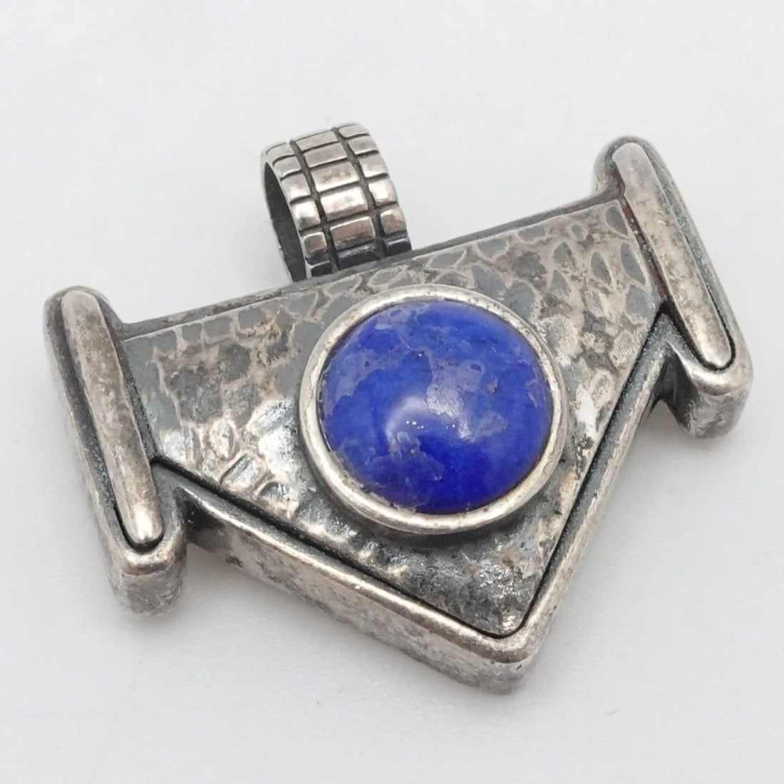 STERLING SILVER ROUND LAPIS LAZULI HAMMERED PENDANT 1": STERLING SILVER ROUND LAPIS LAZULI HAMMERED PENDANT 1" Sterling Silver Round Lapis Lazuli Hammered Pendant Total Length - 1" Bail Width - 5.5mm Gemstone Size - 9mm Total Weight - 13 Grams