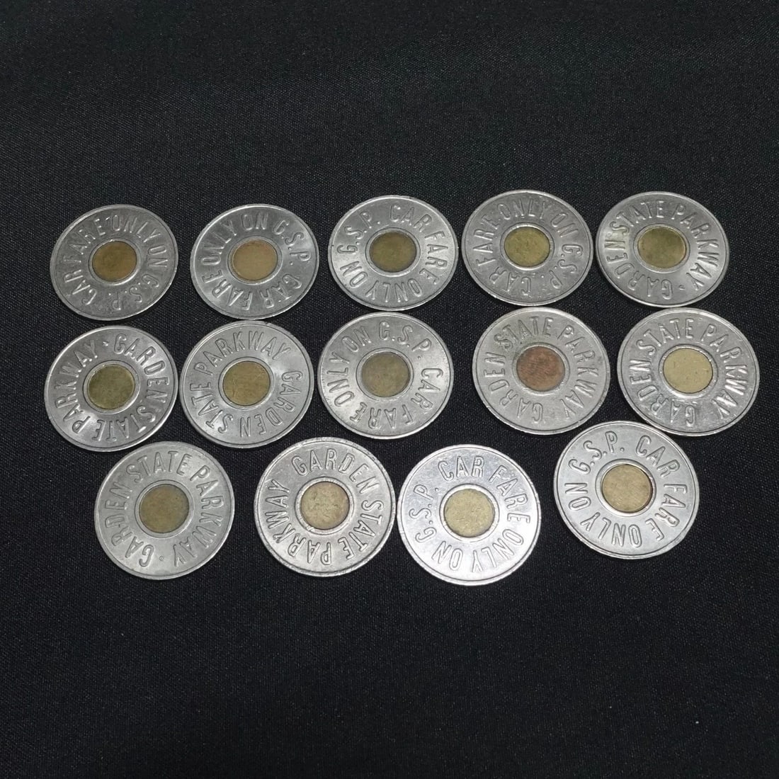 GARDEN STATE PARKWAY GSP NEW JERSEY CAR FARE 14 TOKEN: GARDEN STATE PARKWAY GSP NEW JERSEY CAR FARE 14 TOKEN Lots of 14 Garden State Parkway New Jersey Tokens Circulated *8 coins have OC Mint from 1988* OC - Osborne Coinage, Cincinnati, Ohio US Coins Cond