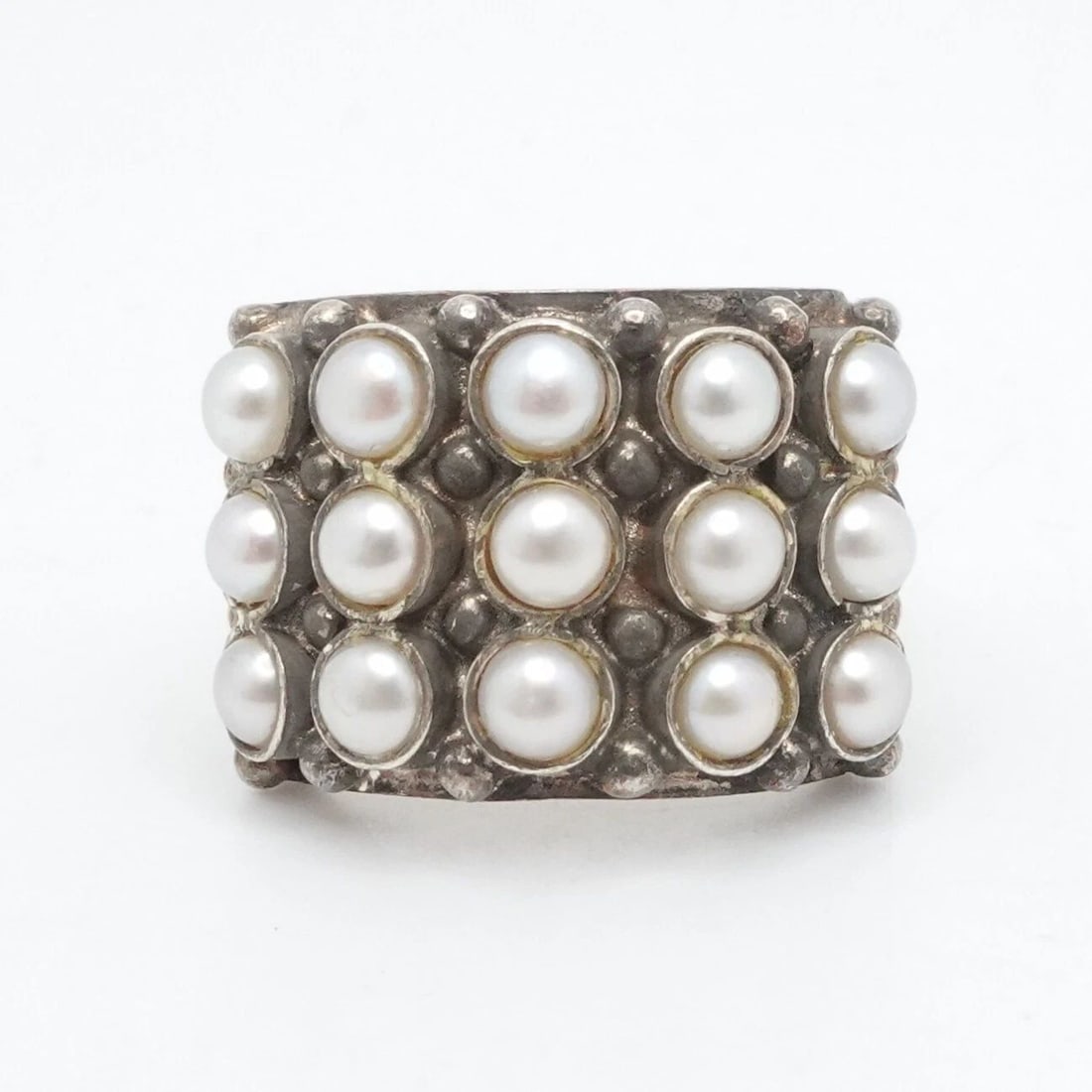 STERLING SILVER THREE ROW ROUND WHITE PEARL RING SIZE 6: STERLING SILVER THREE ROW ROUND WHITE PEARL RING SIZE 6 Vintage Sterling Silver Three Row Round Bezel Pearl Ring Size - 6 Band Width - 5mm Pearl Size - 4mm Total Weight - 10 Grams Hallmark - 925