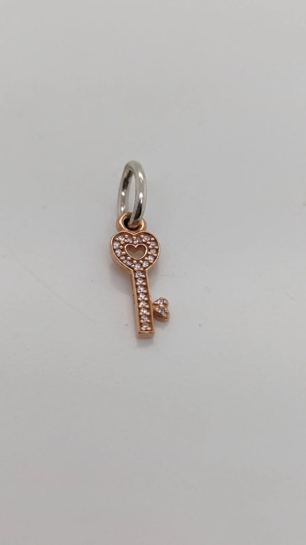 AUTHENTIC PANDORA 14K ROSE GOLD TRUST KEY HEART RETIRED DANGLE CHARM ALE 585: AUTHENTIC PANDORA 14K ROSE GOLD TRUST KEY HEART RETIRED DANGLE CHARM ALE 585 Authentic Pandora 14K Rose Gold Trust Key Heart Retired Dangle Charm ALE 585 Style # 791358CZ Est. Retail - $120 USD