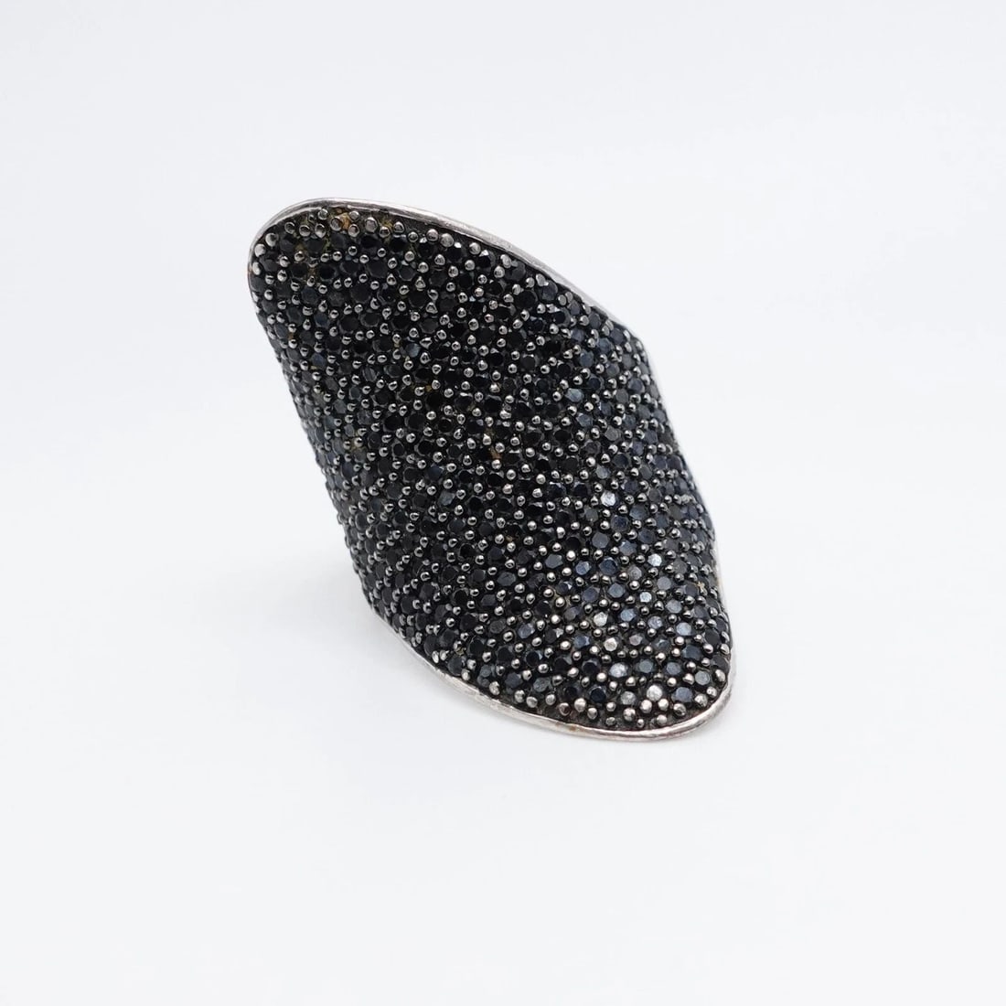 STERLING SILVER PAVE BLACK GEMSTONE CURVED STATEMENT RING SIZE 11.5: STERLING SILVER PAVE BLACK GEMSTONE CURVED STATEMENT RING SIZE 11.5 Sterling Silver Pave Black Gemstone Curved Statement Ring Size - 11.5 Band Width - 4mm Ring Height - 1.5" in Ring Width - 1.2" in To