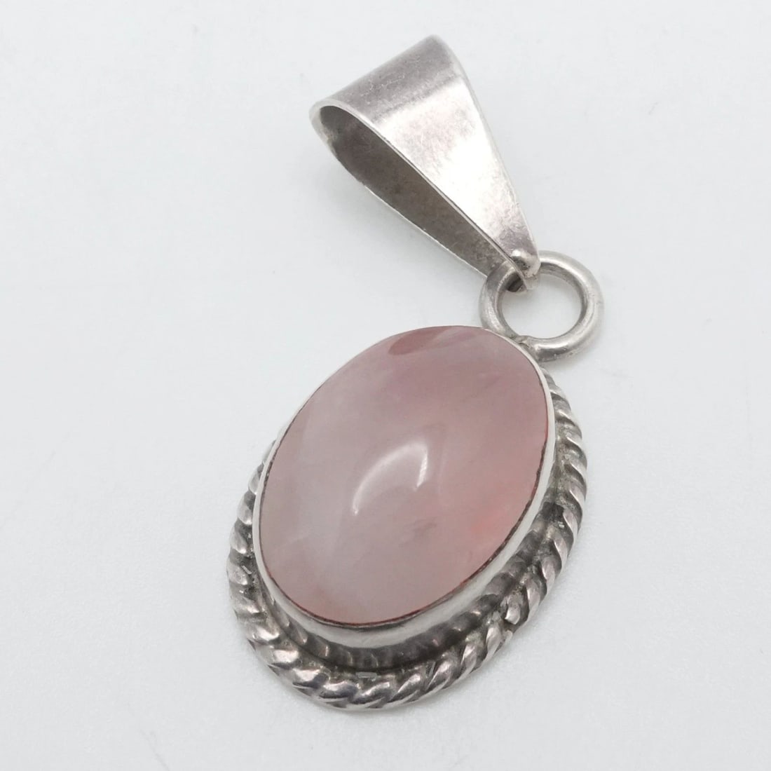 TAXCO STERLING SILVER MEXICO CABOCHON PINK ROSE QUARTZ OVAL PENDANT 2": TAXCO STERLING SILVER MEXICO CABOCHON PINK ROSE QUARTZ OVAL PENDANT 2" Taxco Sterling Silver Mexico Cabochon Pink Rose Quartz Oval Pendant Length - 2" Width - 20mm Bail Size (HxW) - 16mm x 9mm Gemston