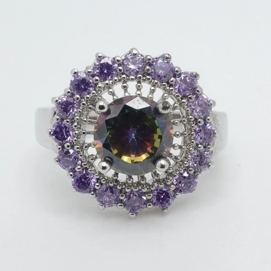 STERLING SILVER ROUND MYSTIC TOPAZ & AMETHYST HALO RING 6.25: STERLING SILVER ROUND MYSTIC TOPAZ & AMETHYST HALO RING 6.25 Sterling Silver Round Mystic Topaz & Amethyst Halo Ring Size - 6.25 Band Width - 2mm Total Weight - 4.4 Grams