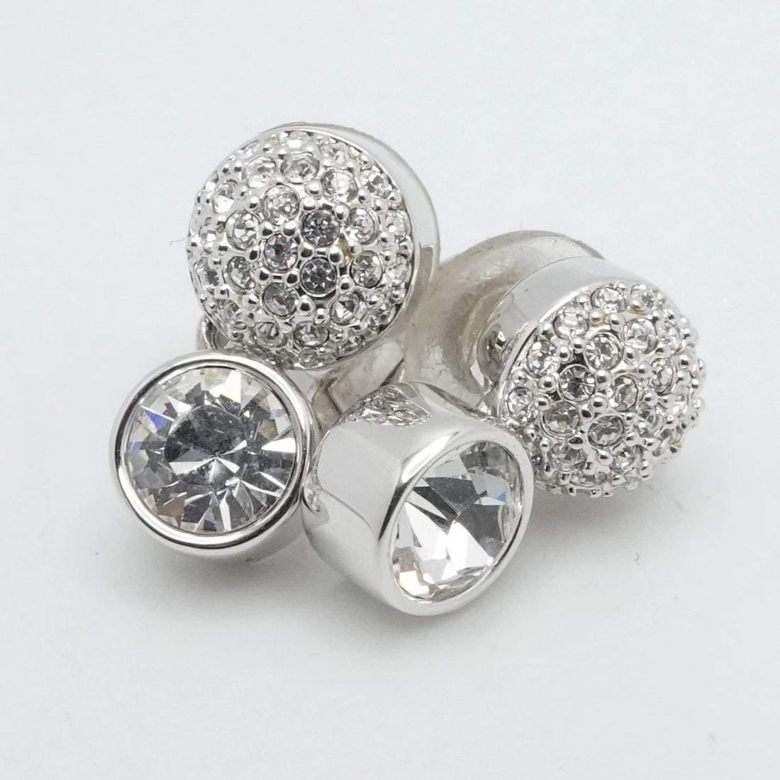 SWAROVSKI SILVER PLATED ROUND PAVE CLEAR CRYSTAL CLIP ON DROP EARRING 3/4": SWAROVSKI SILVER PLATED ROUND PAVE CLEAR CRYSTAL CLIP ON DROP EARRING 3/4" Vintage Swarovski Silver Tone Pave Clear Crystal Clip-On Drop Earring Length - 3/4" Width - 9mm Depth - 5.5mm Thick Total Wei