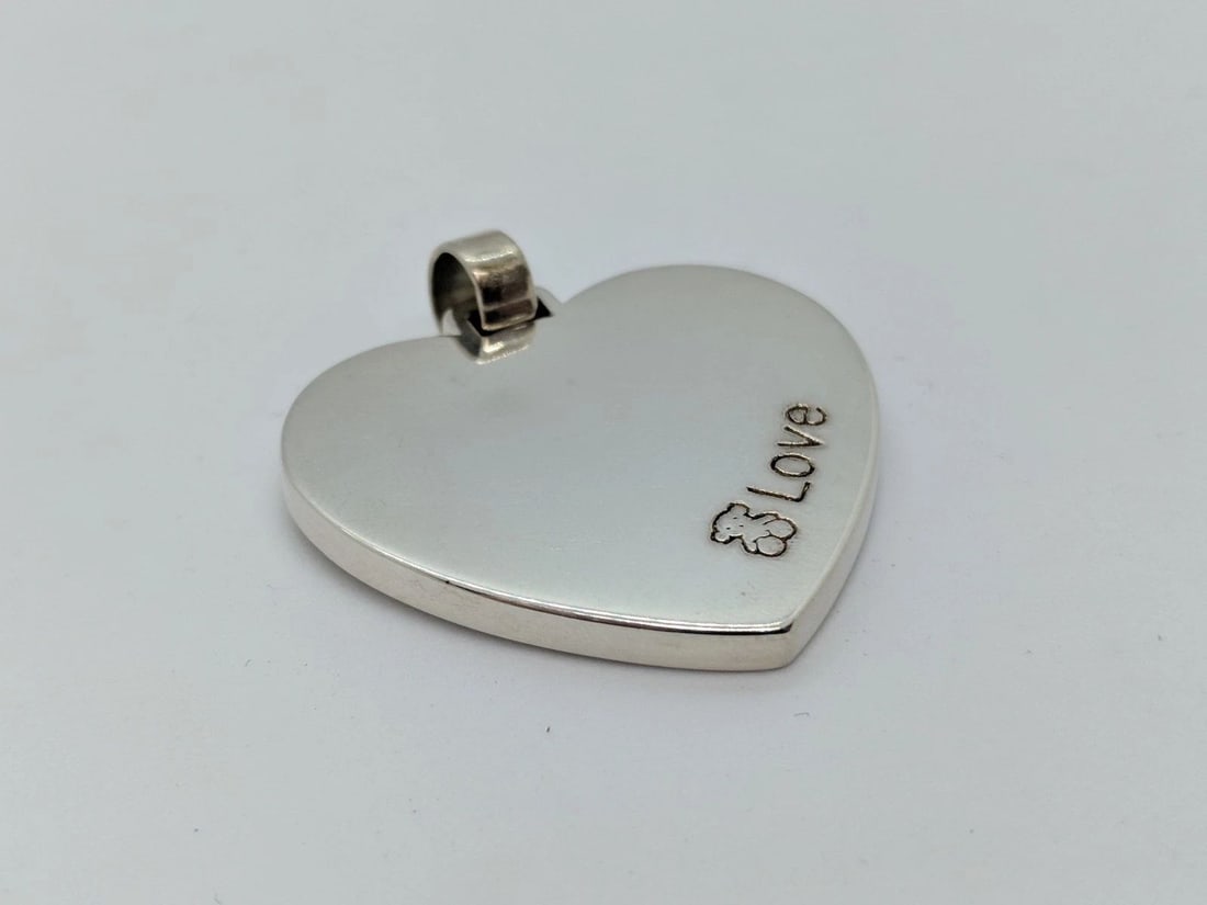 TOUS STERLING SILVER LOVE HEART PENDANT 1.75": TOUS STERLING SILVER LOVE HEART PENDANT 1.75" Tous Love & Hearts Pendant Sterling Silver .925 Height w. bail - 1.75" Width - 38mm (1.5") Depth - 3mm Thick Bail Height - 5mm Bail Width - 6mm Weight - 1