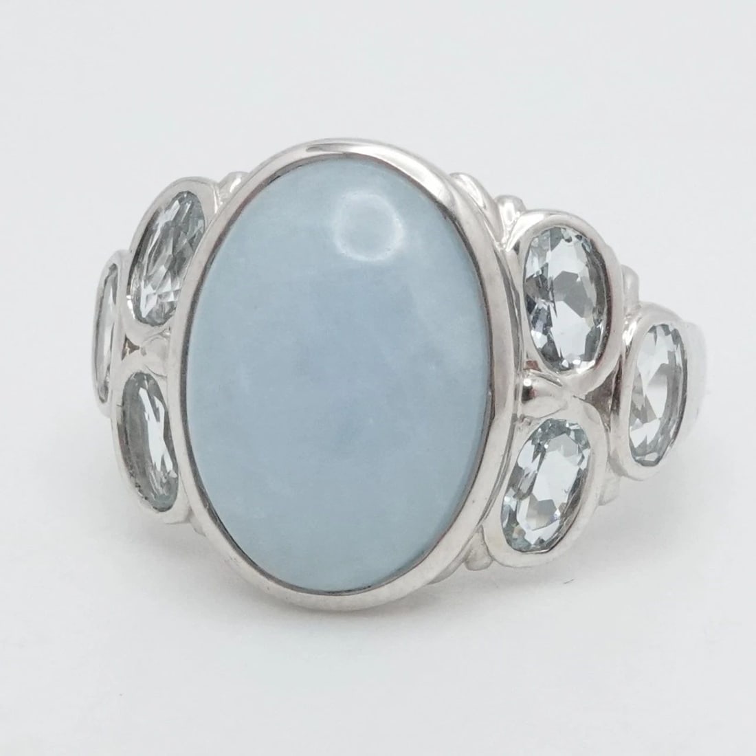 STERLING SILVER CABOCHON BLUE LARIMAR & BLUE TOPAZ ACCENT RING SIZE 8.25: STERLING SILVER CABOCHON BLUE LARIMAR & BLUE TOPAZ ACCENT RING SIZE 8.25 Sterling Silver Cabochon Blue Larimar & Blue Topaz Accent Ring Size - 8.25 Stone Size - 9 x 13mm Total Weight - 5Grams