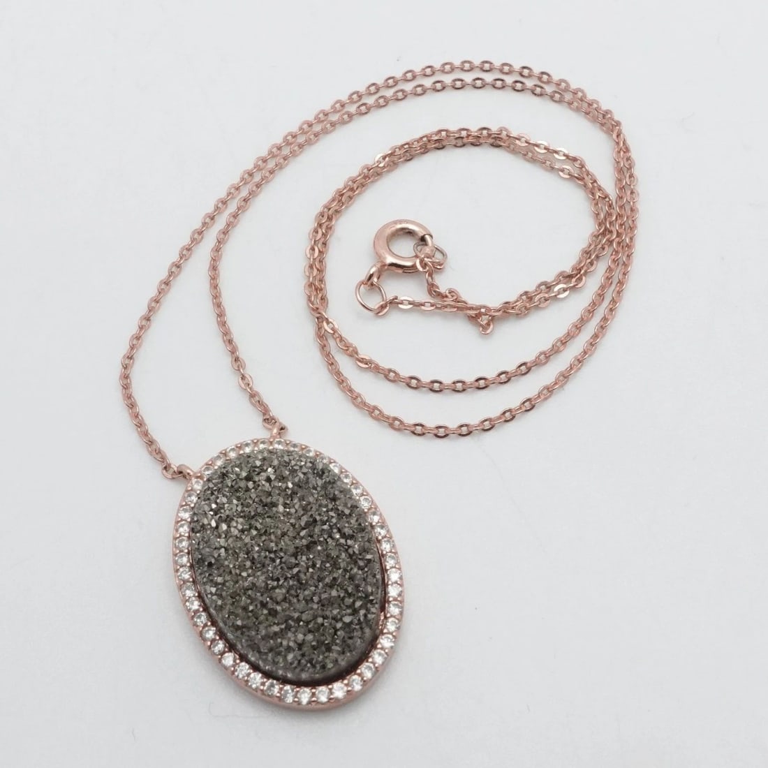 ROSE GOLD PLATED STERLING SILVER OVAL GRAY DRUZY CZ HALO PENDANT NECKLACE 18": ROSE GOLD PLATED STERLING SILVER OVAL GRAY DRUZY CZ HALO PENDANT NECKLACE 18" Signed N Rose Gold Plated Sterling Silver Oval Gray Druzy CZ Halo Pendant Necklace Length - 18" Chain Width - 1mm Pendant 