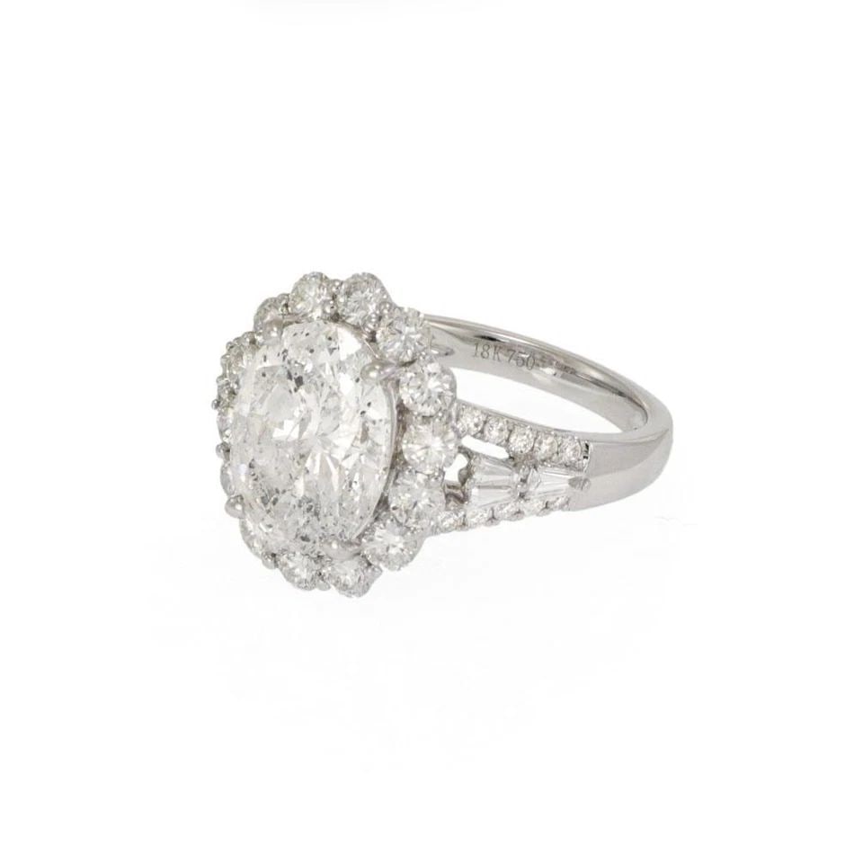 GORGEOUS 5.62CT DIAMOND OVAL 18K WHITE GOLD ENGAGEMENT RING: GORGEOUS 5.62CT DIAMOND OVAL 18K WHITE GOLD ENGAGEMENT RING Gorgeous 5.62ct Diamond Oval 18k White Gold Engagement Ring Description This is a stunning engagement halo ring, crafted from 18k white gold