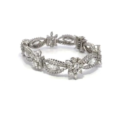 PLATINUM 14CT DIAMOND BRACELET FLORAL & MARQUISE LINK DRESS WEAR: PLATINUM 14CT DIAMOND BRACELET FLORAL & MARQUISE LINK DRESS WEAR This is a magnificent diamond bracelet; it is crafted from platinum featuring alternating long open marquise shape links with a floral 