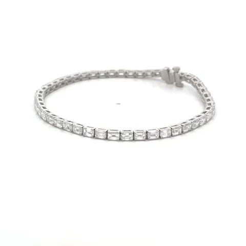 DIAMOND LINE TENNIS BRACELET EMERALD CUT 6.80CT 18K WHITE GOLD NEW: DIAMOND LINE TENNIS BRACELET EMERALD CUT 6.80CT 18K WHITE GOLD NEW This is an eye-catching NEW line tennis bracelet. It is crafted from 18k white gold with a polished finish featuring the entire lengt