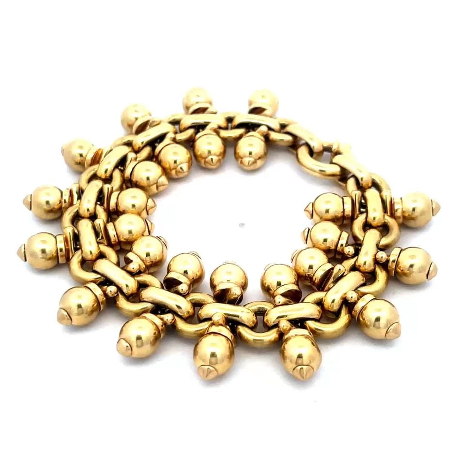 OMAR TORRES GOLD BRACELET 18K YELLOW DOUBLE ROW BEAD STYLE 75 GRAMS: Elevate your accessory collection with the Omar Torres gold bracelet, a sophisticated piece crafted from 18k yellow gold. This bracelet features a double row of bead-style accents on each end with rou