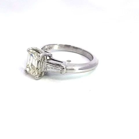 EMERALD CUT ENGAGEMENT RING 1.85CT DIAMOND PLATINUM W/ACCENT: EMERALD CUT ENGAGEMENT RING 1.85CT DIAMOND PLATINUM W/ACCENT This stunning engagement ring is crafted from platinum featuring an emerald cut 1.85 carat diamond set in the center and is held securely i