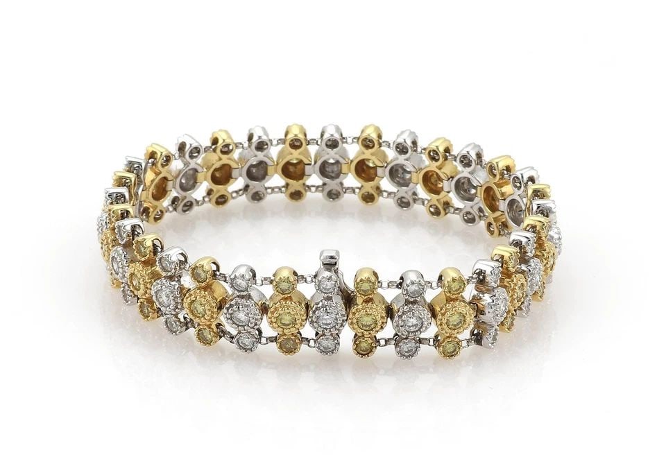ESTATE 4CT FANCY YELLOW WHITE DIAMOND 18K GOLD 3 ROW BRACELET: ESTATE 4CT FANCY YELLOW WHITE DIAMOND 18K GOLD 3 ROW BRACELET Estate 4ct Fancy Yellow White Diamond 18k Gold 3 Row Bracelet Description This impressive bracelet is crafted from 18k yellow and white go