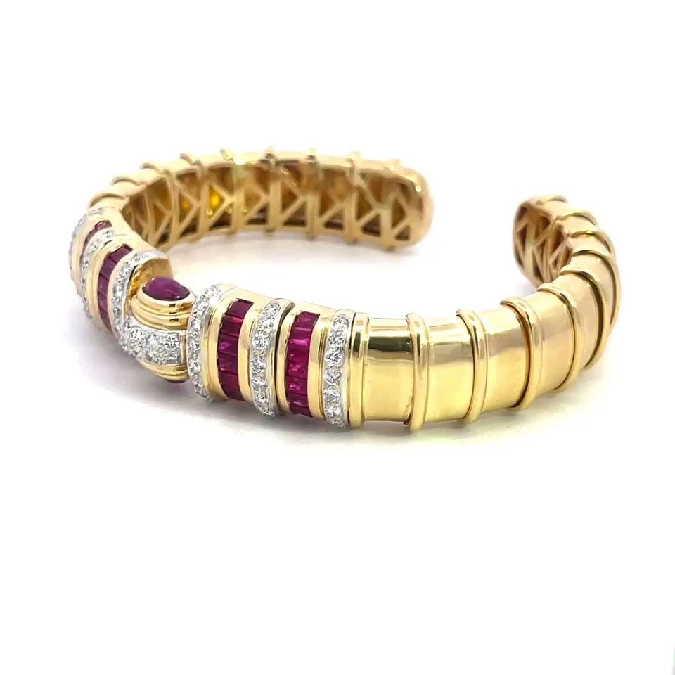 RUBY GOLD CUFF BRACELET DIAMOND 18K YELLOW WIDE FLEX BAND: RUBY GOLD CUFF BRACELET DIAMOND 18K YELLOW WIDE FLEX BAND This fabulous cuff bracelet is crafted from 18k yellow gold with a polished finish. The 14mm wide band has rectangle shape section with a slim