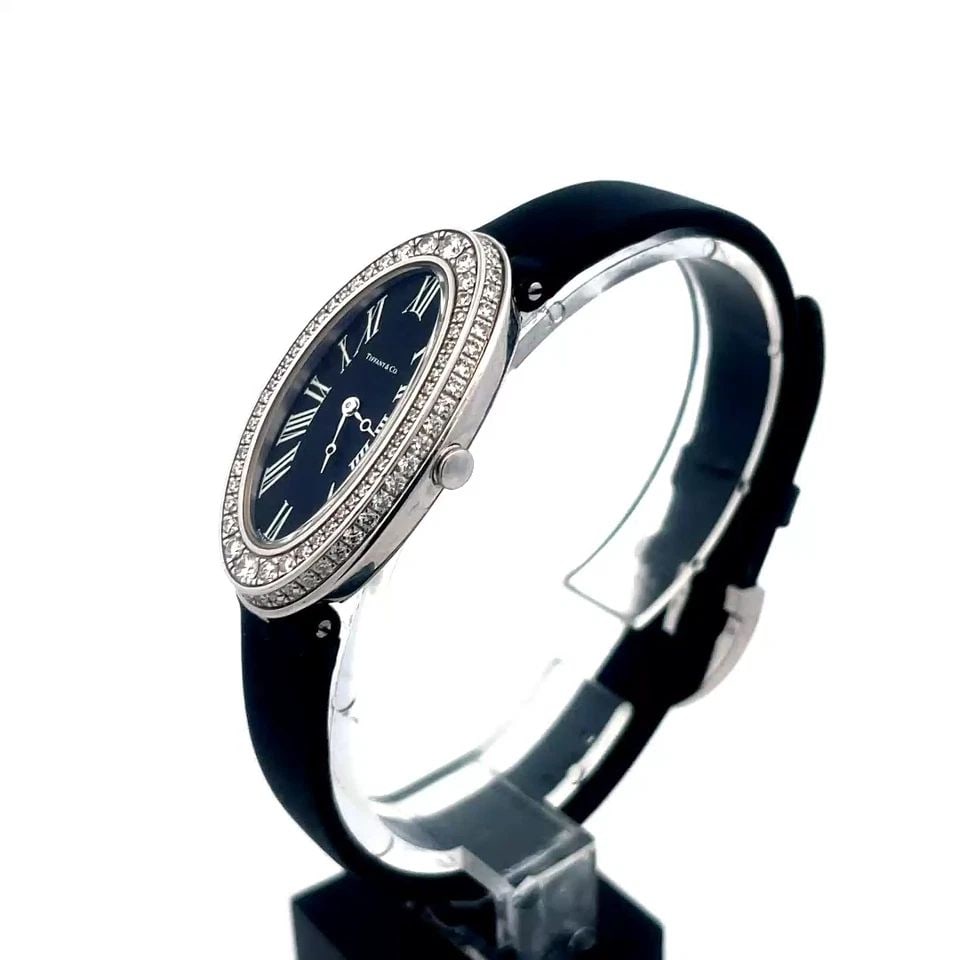 6840 TIFFANY & CO. DIAMOND GOLD WRISTWATCH LADIES DOUBLE ROW BEZEL 18K WHITE: 6840 TIFFANY & CO. DIAMOND GOLD WRISTWATCH LADIES DOUBLE ROW BEZEL 18K WHITE Elegant and authentic from Tiffany & Co. This lovely quartz Swiss ladies wristwatch is crafted from 18k white gold featurin