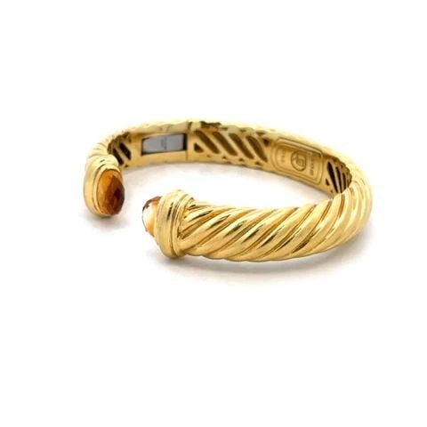 DAVID YURMAN GOLD CUFF BRACELET CITRINE CABLE KICK STYLE: DAVID YURMAN GOLD CUFF BRACELET CITRINE CABLE KICK STYLE This authentic David Yurman bracelet is from the Classic Cable Collection in the cuff style. It is crafted from 18k yellow gold with a polished