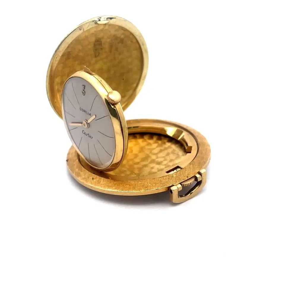 CORUM CARTIER GOLD POCKETWATCH 18K YELLOW FULL HUNTER VINTAGE: This is a vintage 18k yellow gold full hunter pocket watch by Corum for Cartier the case has a textured brush finish and the watch inside the case is 26mm with acrylic cover, champagne color face with